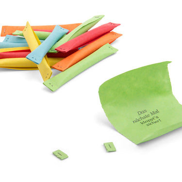 Bunte Papierstreifen mit Sprüchen wie 'Das nächste Mal klappt's sicher!' – personalisierte Geschenkidee